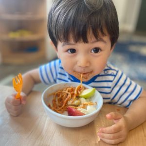 Karter student eating pasta